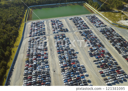 Aerial view of auction reseller company big parking lot with parked cars ready for remarketing services. Sales of secondhand vehicles Aerial view of auction reseller company big parking lot with parked cars ready for remarketing services. Sales of secondhand vehicles 121381095