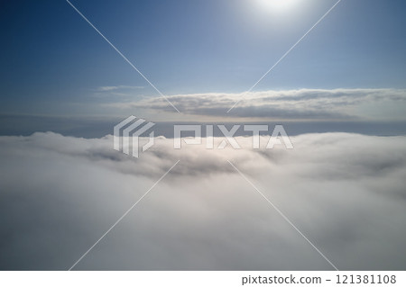Aerial view from high altitude of earth covered with puffy rainy clouds forming before rainstorm Aerial view from high altitude of earth covered with puffy rainy clouds forming before rainstorm 121381108