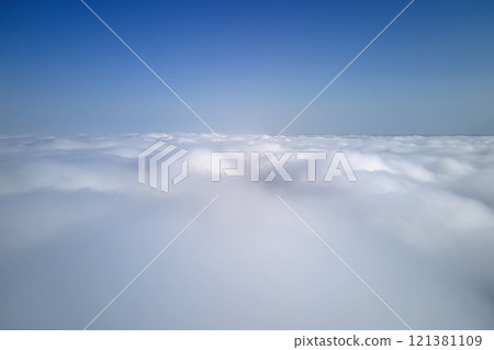 Aerial view from high altitude of earth covered with puffy rainy clouds forming before rainstorm Aerial view from high altitude of earth covered with puffy rainy clouds forming before rainstorm 121381109