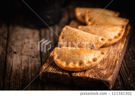 Traditional baked Spanish empanadas 121381302