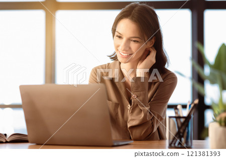 Working Process. Successful female grapic designer watching tutorial about creative ideas on laptop computer, copyspace 121381393