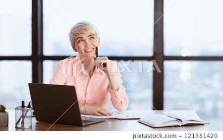 Cheerful Lady At Laptop Dreaming About Successful Business Career Working Sitting At Workplace In Modern Office. Free Space 121381420