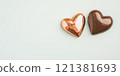 Valentine Day chocolate candy heart shaped gift. Romantic love greeting present milk choco. Golden foil dessert macro photo background 121381693