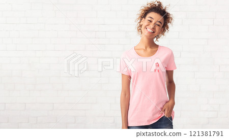 Breast Cancer Volunteer Girl Smiling To Camera Posing Over White Brick Wall. Empty Space For Text Breast Cancer Volunteer Girl Smiling To Camera Posing Over White Brick Wall. Empty Space For Text 121381791