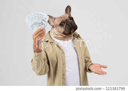 A whimsical representation shows a dog with a human-like body holding a stack of cash, appearing both confused and amused. The backdrop is a simple, neutral studio environment A whimsical representation shows a dog with a human-like body holding a stack of cash, appearing both confused and amused. The backdrop is a simple, neutral studio environment 121381799