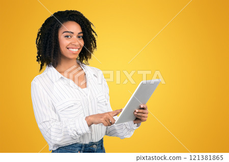 Online Education. Smiling afo woman holding digital tablet and looking to camera over white studio background, copyspace 121381865
