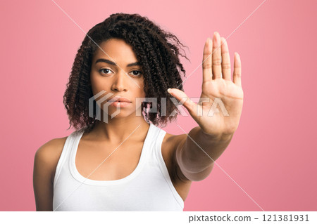 Enough, Time To Stop. Serious african american woman showing palm or no gesture, being disappointed 121381931