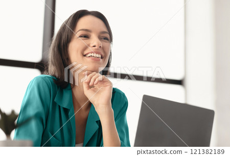 Lifestyle Concept. Portrait of happy girl looking to the side, working on laptop, daydreaming, copyspace 121382189