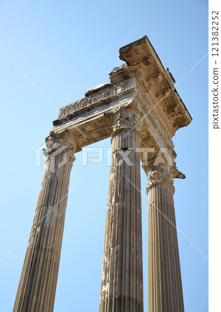 Ionic Columns of the Temple of Saturn in the Forum Romanum, Rome, Italy, clear blue sky sunny day 121382252