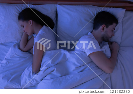 Sexless Relationship. Couple Sleeping Lying Back-To-Back Having No Sexual Life In Bed At Home At Night. Top-View, Low Light 121382280