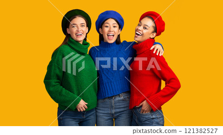 Best Friends. Three Happy Multiethnic Girls Embracing Smiling At Camera Standing In Studio Over Yellow Background. Panorama Best Friends. Three Happy Multiethnic Girls Embracing Smiling At Camera Standing In Studio Over Yellow Background. Panorama 121382527