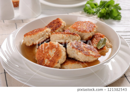 turkey potato cakes in white bowl, top view turkey potato cakes in white bowl, top view 121382543