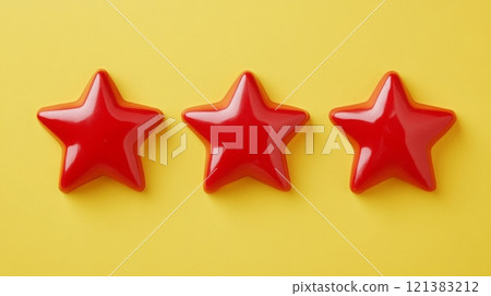 Three glossy red stars are perfectly aligned on a bright yellow background, creating a striking visual contrast that draws attention and adds a playful feel to the composition. 121383212
