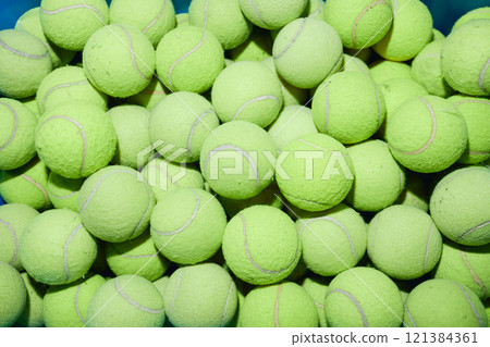 Top view of tennis balls lumped together in pile as tool for gentle wash or effective dry clothing in machine, copy space 121384361