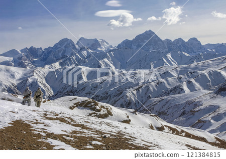 Rangers patrol protected mountain areas with weapons after snowfall. Rangers patrol protected mountain areas with weapons after snowfall. 121384815