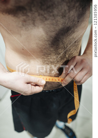 Measuring waist size is essential for achieving your desired fitness goals and objectives Measuring waist size is essential for achieving your desired fitness goals and objectives 121385956