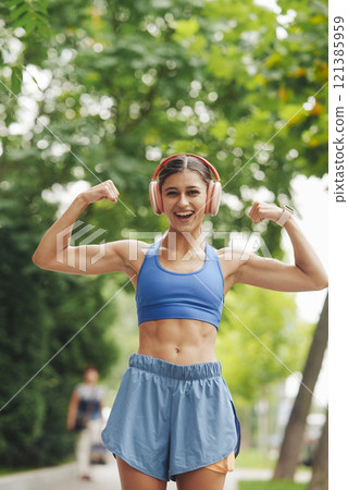 An Empowered Fitness Woman is Showcasing Her Strength in the Beautiful Outdoors of Nature An Empowered Fitness Woman is Showcasing Her Strength in the Beautiful Outdoors of Nature 121385959