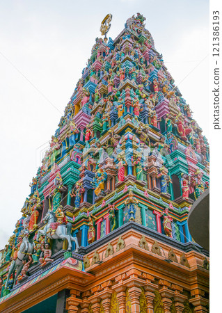 traditional small buddhist temple in kuala lumpur with many figures on facade traditional small buddhist temple in kuala lumpur with many figures on facade 121386193