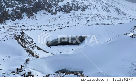 Ice cave high in the snowy mountains. 121386277