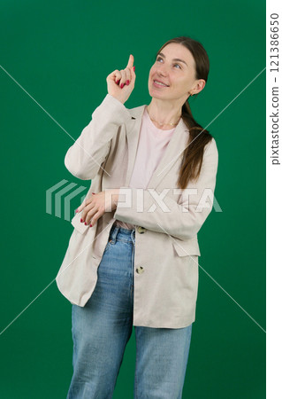Pretty young girl dressed in green colored wear 121386650