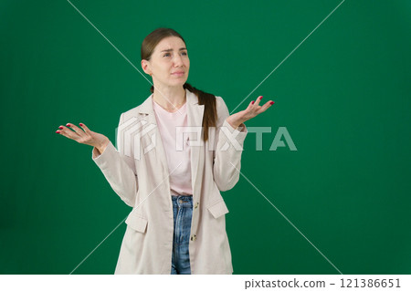 Portrait of confused woman shrug in studio, isolated white background and questioning choice, emoji and reaction. Female model, confusion and dont know why in doubt, uncertainty and body language Portrait of confused woman shrug in studio, isolated white background and questioning choice, emoji and reaction. Female model, confusion and dont know why in doubt, uncertainty and body language 121386651