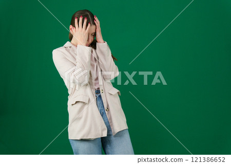 Unhappy young Indian woman standing in domestic laundry room and cover face with palms crying feels miserable. Family problems, break up, marriage split, resentment against her husband, abuse concept 121386652