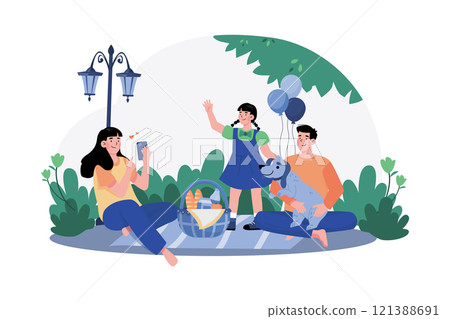 A family enjoys a morning picnic in the park, surrounded by nature. 121388691