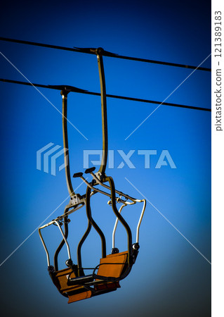 ski lift, landscape with mountains and snow, a ski resort in the mountains  121389183