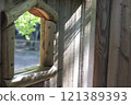 Landscape with lattice door 121389393