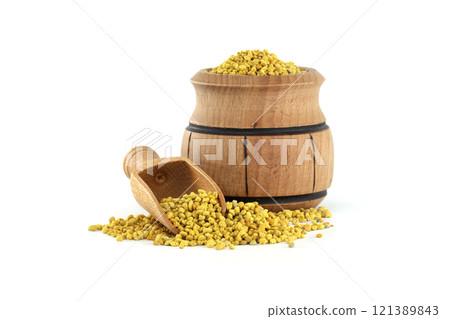Wooden Barrel With Yellow Granules and Small Wooden Scoop 121389843