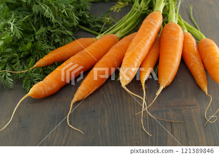 Fresh Organic Carrots on Wooden Background 121389846