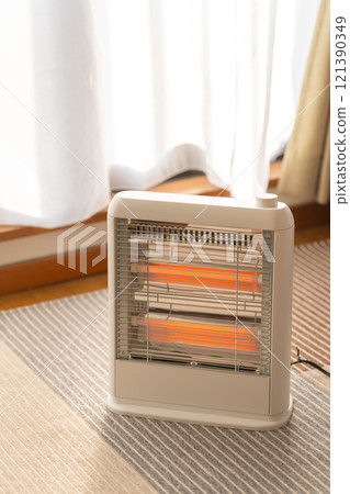 Electric heater in the room 121390349