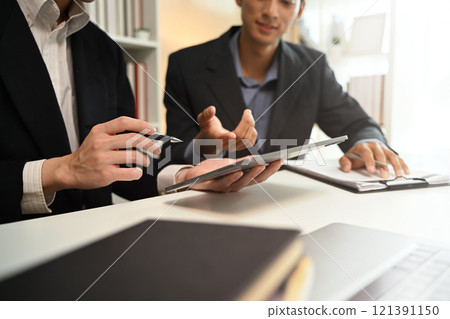 Cropped shot business advisor explaining the contract offering it for the client to sign. Cropped shot business advisor explaining the contract offering it for the client to sign. 121391150