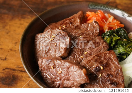 Bibimbap-style beef skirt steak rice bowl made with beef skirt steak 121391625
