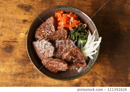 Bibimbap-style beef skirt steak rice bowl made with beef skirt steak 121391626