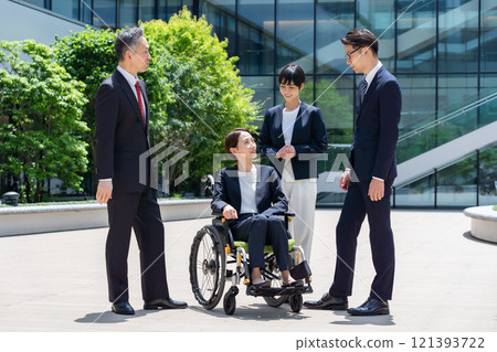 Business wheelchair team Business wheelchair team 121393722