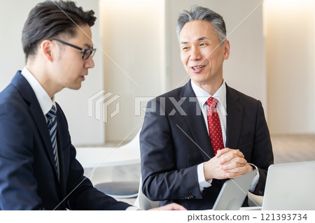 Businessmen having a meeting in the lounge Businessmen having a meeting in the lounge 121393734