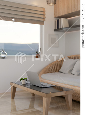 A laptop on a coffee table in a minimalist cozy living room. 121393922