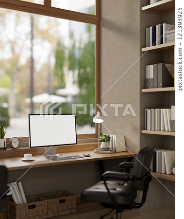A comfortable, minimalist office featuring a computer with a white screen mockup on a wooden desk. A comfortable, minimalist office featuring a computer with a white screen mockup on a wooden desk. 121393925