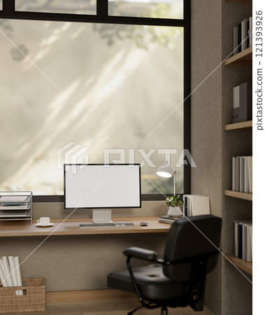 A comfortable, minimalist office featuring a computer with a white screen mockup on a wooden desk. 121393926