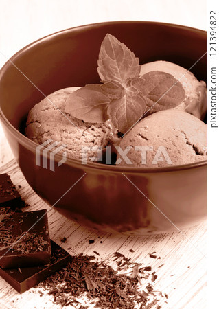 Chocolate ice cream decorated mint leaf tinted in mocha mousse color 121394822