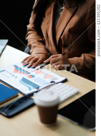 business documents businessman check legal document review Prepare documents or analysis reports, tax items, accounting documents, data contracts, office partner agreements. 121395202