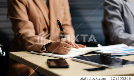 Workers discuss them at the company conference 121395206