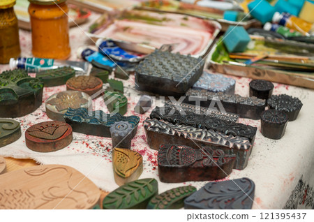 Intricate wooden and metal stamps for artistic block printing 121395437