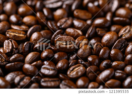 Dark roasted coffee beans background, Arabica coffee Dark roasted coffee beans background, Arabica coffee 121395535