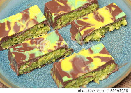 Dubai chocolate bar with pistachio paste and kataifi dough. Confectionery and sweets. 121395638