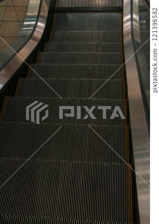 Scenery with an empty escalator Scenery with an empty escalator 121396582