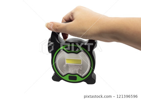 Black flashlight isolated on white background. Black Battery-powered flashlight top view 121396596