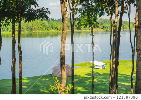 travel and people activity concept with camping on grass  with mountain and lake on foreground 121397390