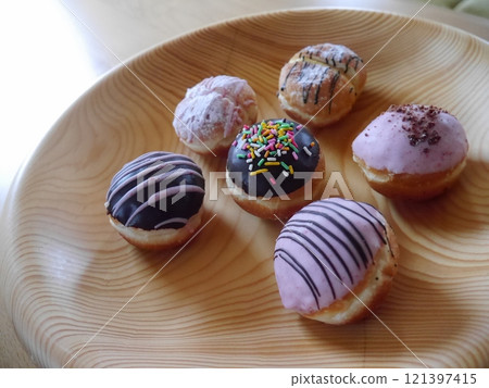 Bite-sized decorated donuts Bite-sized decorated donuts 121397415